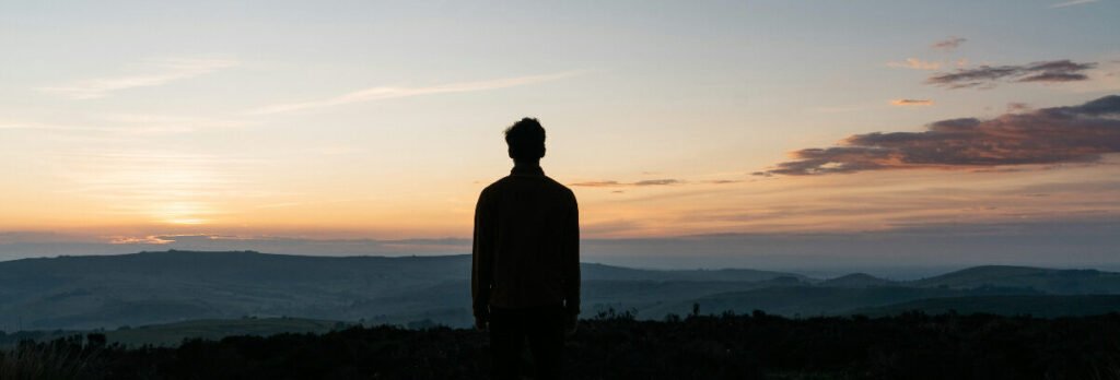 Morning light. A quiet view of through many hills, symbolizing personal growth over time.