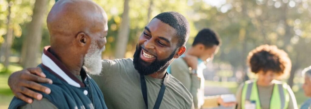 Two people continue talking after a community event, reminding us that meaningful relationships often begin with ordinary conversations.
